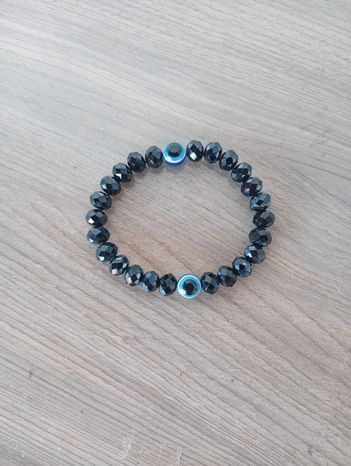 Pulseira de Vidro Preto Facetado com Olho Grego